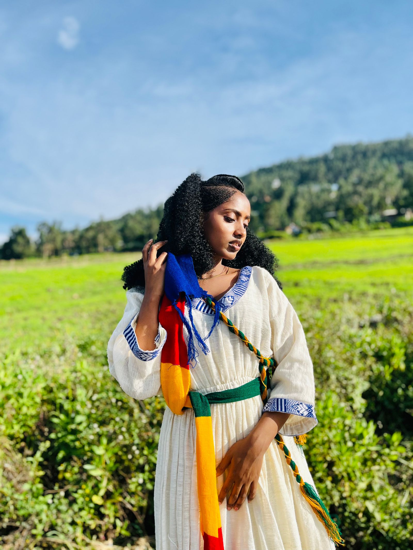 Woman in traditional clothing in a rural field