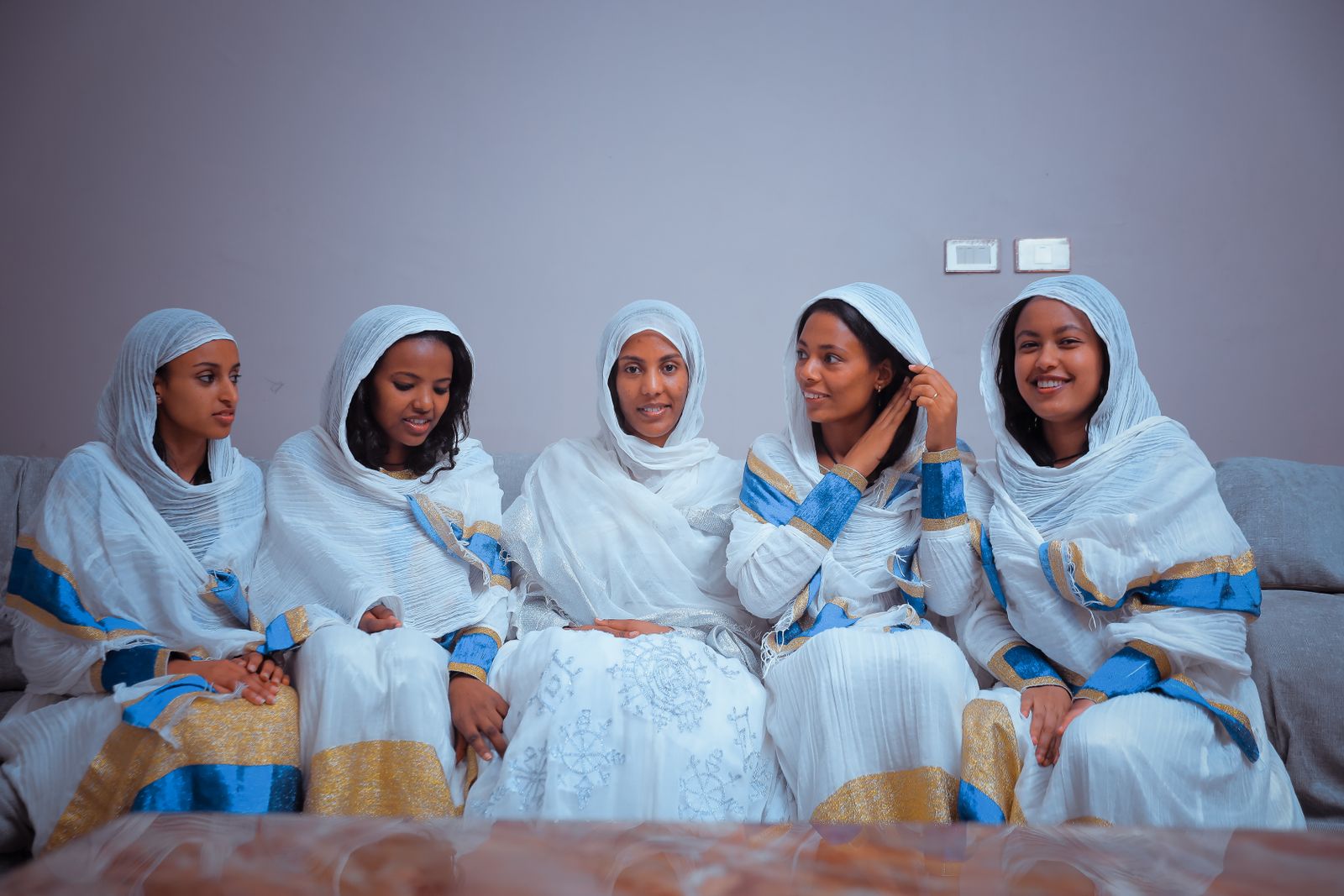 Women posing together in traditional clothing